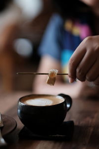 Close-up of hand holding ice cream