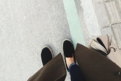 Low section of woman standing on floor