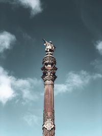 Low angle view of statue of liberty against sky