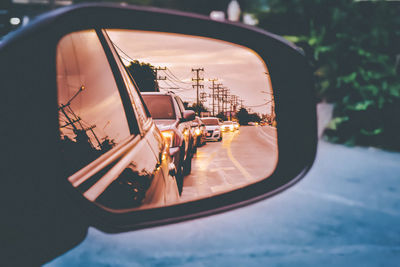 Reflection of cars on side-view mirror