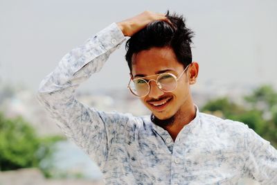 Portrait of young man wearing sunglasses