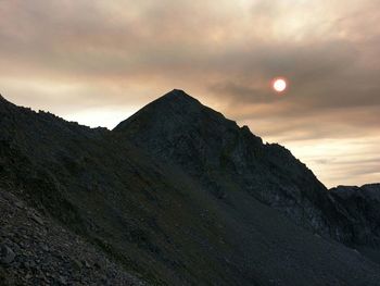 Low angle view of mountain against sky during sunset
