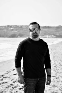 Portrait of man standing on beach