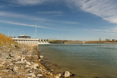 Bridge over river against sky