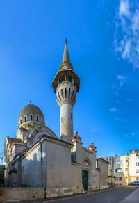 Low angle view of building against blue sky