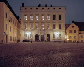 Buildings in city at night