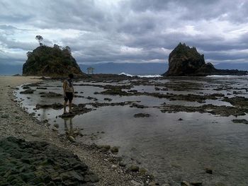 Scenic view of sea against cloudy sky