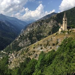 Scenic view of valley and mountains against sky