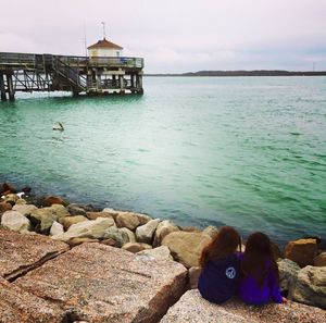 View of sea with people in background