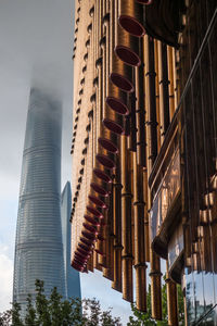 Low angle view of buildings against sky in city