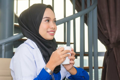 Portrait of young woman smiling