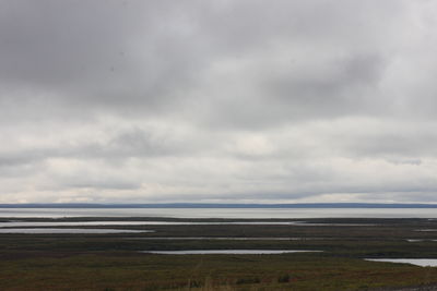 Scenic view of beach against sky