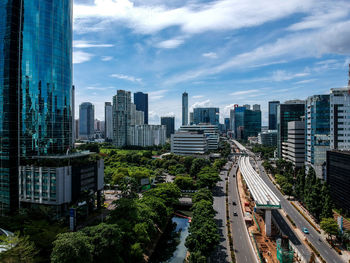 High angle view of buildings in city against sky