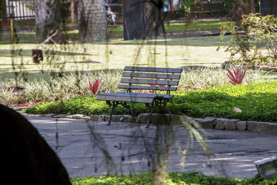 Low section of person on bench in park