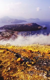 Scenic view of waterfall against sky