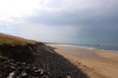 Scenic view of beach against sky