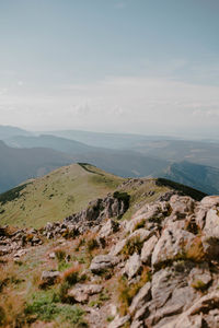 Scenic view of sea and mountains against sky