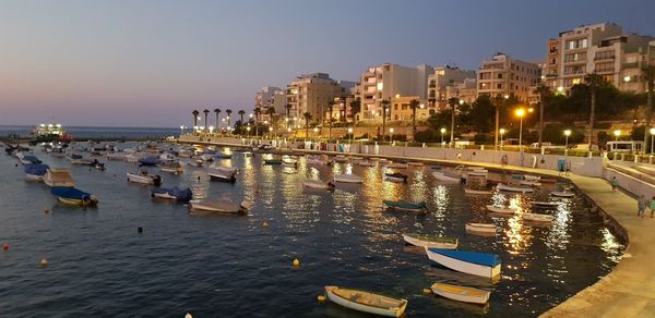 Panoramic view of sea and buildings at night