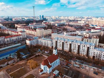 High angle view of city buildings against sky