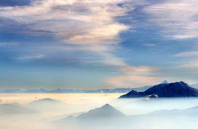 Scenic view of mountains against sky during winter