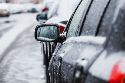 Icicles on car side-view mirror