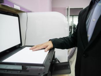 Midsection of woman working in office