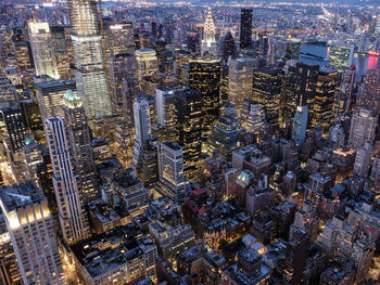 High angle view of illuminated buildings in city