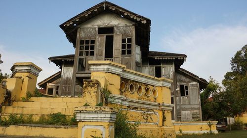 Low angle view of old building against sky