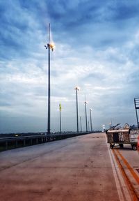 Street by road against sky