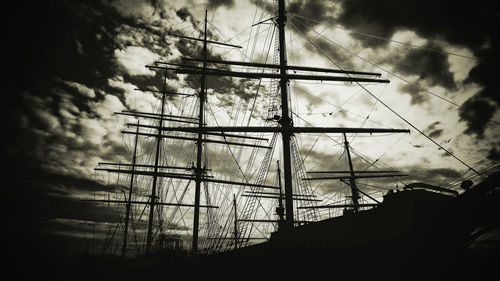 Low angle view of silhouette trees against sky