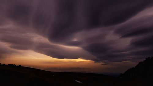 Scenic view of dramatic sky during sunset