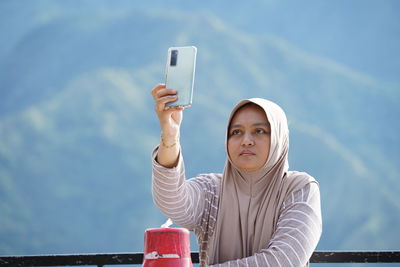 Young woman using mobile phone