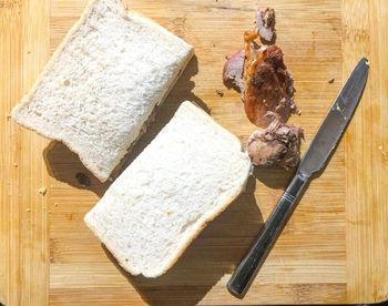 High angle view of chopped bread on cutting board