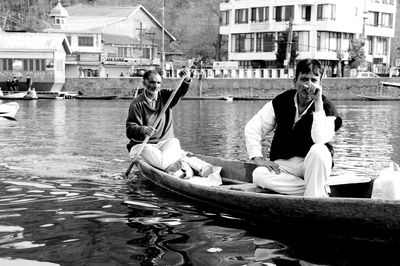 People sitting on boat in water