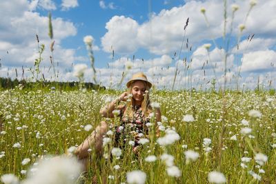 Portrait of young woman in field