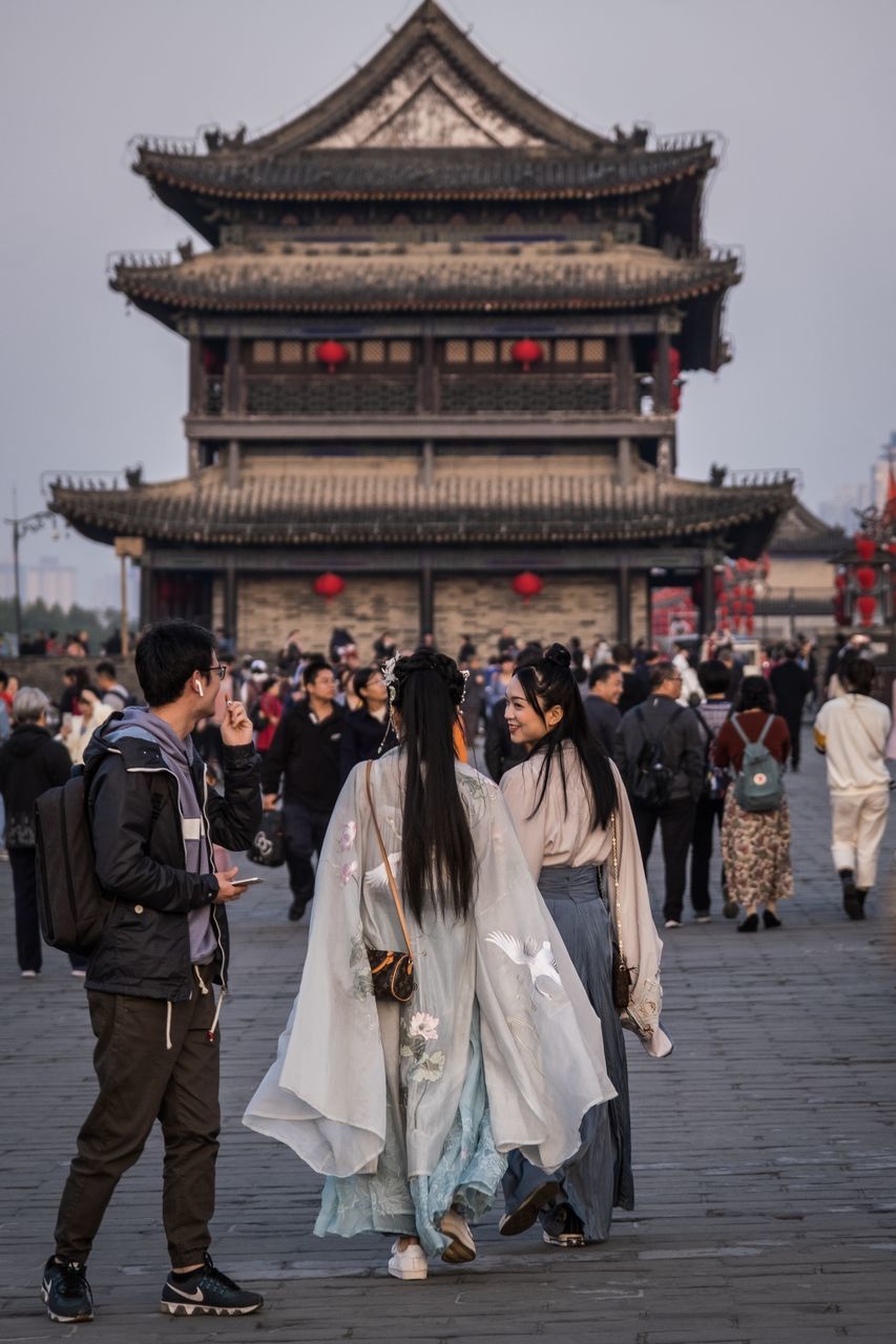 architecture, real people, built structure, group of people, building exterior, men, large group of people, travel destinations, women, lifestyles, adult, tourism, crowd, rear view, building, day, clothing, religion, outdoors