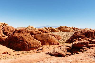 Rock formations in desert against clear sky