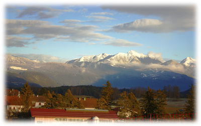 Scenic view of mountains against sky during winter