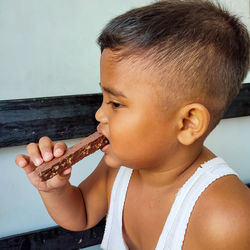 Portrait of boy eating food