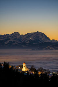 Panoramic view over the church of eichenberg to the alpstein massif with the säntis at sunset 