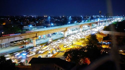 High angle view of light trails on road at night