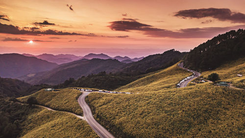 Scenic view of mountains against sky during sunset