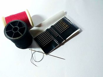 High angle view of telephone booth on table against white background