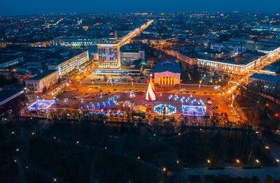 High angle view of illuminated buildings in city at night