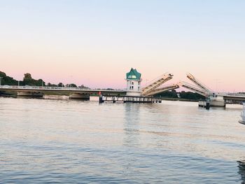 View of bridge over river against clear sky