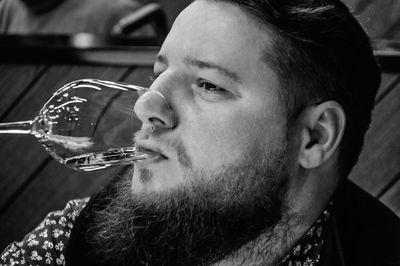 Close-up of man drinking glass