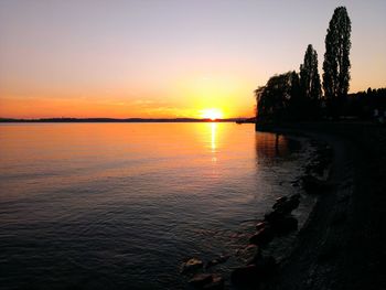 Scenic view of sunset over river