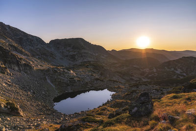 Scenic view of mountains against sky during sunset