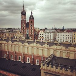 Krakow cityscape against cloudy sky