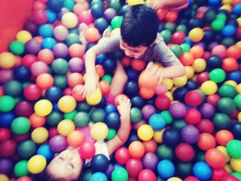 High angle view of boy playing with ball